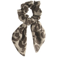 Chouchou élastique pour cheveux en forme de foulard noué en textile de couleur avec motif panthère.