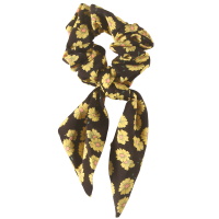 Chouchou élastique pour cheveux en forme de foulard noué en textile de couleur avec motifs fleurs.