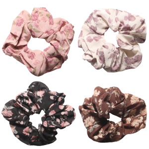 Chouchou élastique pour cheveux en textile de couleur avec motifs de fleurs. 4 coloris différents. Votre préférence en commentaire. Vendu à l'unité.