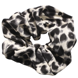 Chouchou élastique pour cheveux en textile de couleur avec motifs.