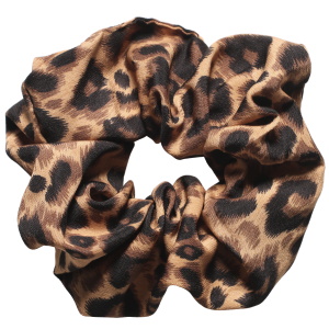 Chouchou élastique pour cheveux en textile de couleur avec motifs.