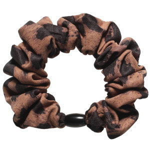 Chouchou élastique pour cheveux en textile de couleur avec motifs.