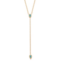 Collier en forme Y composé d'une chaîne en plaqué or 18 carats et deux gouttes serties de pierres d'imitation turquoise. Fermoir mousqueton avec anneaux de rappel à 40, 42 et 45 cm.