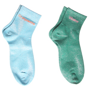 Paire de chaussettes en textile à paillettes avec le message Vilaine ou Craquante. 2 coloris différents. Vendu par paire. Votre préférence en commentaire.