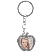 Porte-clés en métal argenté avec pomme pour y insérer une photo. Taille photo 2.9 x 3.5 cm