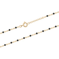 Collier composé d'une chaîne en plaqué or jaune 18 carats et de perles en résine de couleur noire. Fermoir anneau ressort avec 3 cm de rallonge.