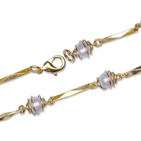 Bracelet en plaqué or jaune 18 carats et perles d'imitation.