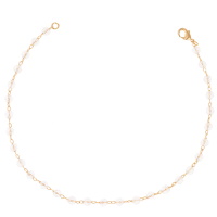 Bracelet composé d'une chaîne en plaqué or jaune 18 carats avec perles de cristaux transparents.
