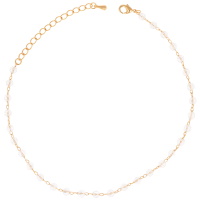 Bracelet chaîne de cheville en plaqué or jaune 18 carats avec perles de cristaux de couleur blanche. Fermoir mousqueton avec 5 cm de rallonge.