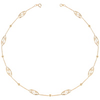 Collier sautoir composé d'une chaîne avec boules et motifs filigranes en plaqué or jaune 18 carats.