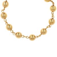 Collier composé d'une chaîne avec boules en plaqué or jaune 18 carats.